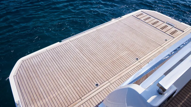 Slide: The Image of Spacious Teak Swim Platform The NEW Prestige F5.7 features an expansive teak swim platform, perfect for enjoying water activities. Its sleek design and high-quality finish provide both functionality and elegance. Easily accessible, this area offers a seamless transition between the - 7312528