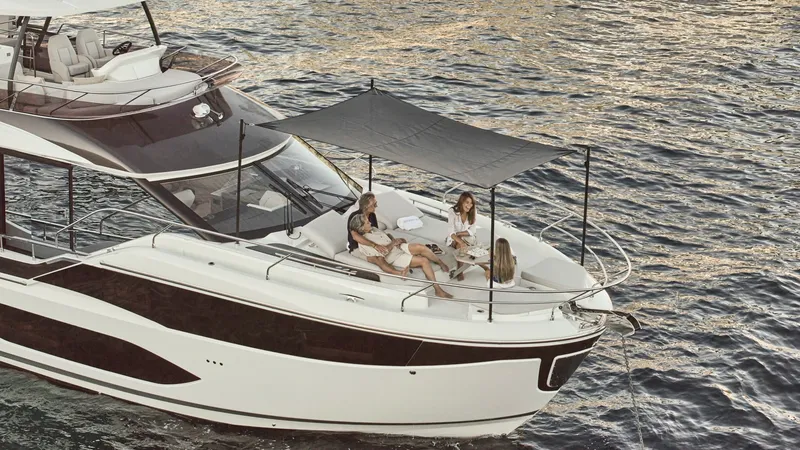 Slide: The Image of Foredeck Lounge with Canopy The foredeck of the 2027 Prestige F5.7 features a spacious lounge area, perfect for socializing and relaxation. Equipped with a stylish canopy, it offers shade and comfort while enjoying the sea views. The sleek design and high-quality materials enhance t - 7312527