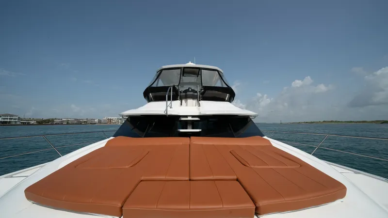 Slide: The Image of Foredeck with Sunpad Loungers The foredeck of the Aquila 44 CAT features spacious sunpad loungers, offering a luxurious spot for relaxation under the sun. The sleek design and premium materials ensure comfort and style, harmonizing with the vessel's modern aesthetic. With expansive vi - 7414001