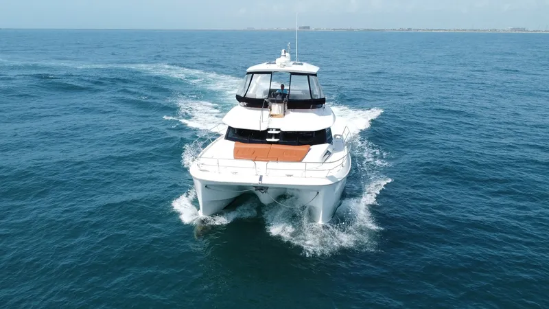 Slide: The Image of Aquila 44 CAT Bow View The 2021 Aquila 44 CAT showcases its sleek and modern bow design, cutting through the water with grace. The spacious front deck features comfortable seating, ideal for relaxation and enjoying panoramic ocean views. The vessel's dual hulls provide stabilit - 7414020
