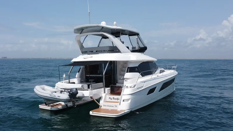 Slide: The Image of Aft Deck and Flybridge View The Aquila 44 CAT 'Hey Beautiful' showcases a spacious aft deck with comfortable seating, perfect for entertaining and relaxation. The flybridge offers panoramic views and is equipped with a sturdy bimini for shade. The vessel's sleek lines and modern des - 7414037