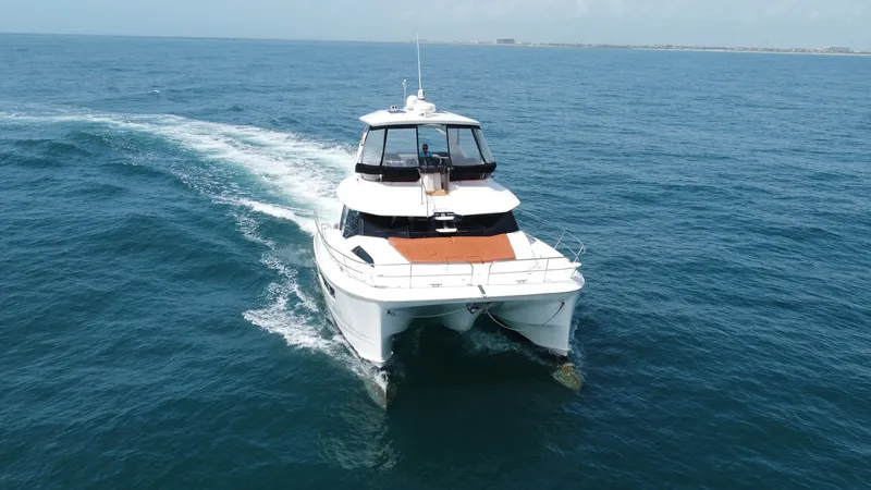 Slide: The Image of Aquila 44 CAT Bow View Experience the sleek design and stability of the 2021 Aquila 44 CAT as it glides through open waters. The bow features spacious deck seating perfect for relaxation and enjoying panoramic ocean views. Its modern lines and dynamic form highlight the vessel' - 7414017