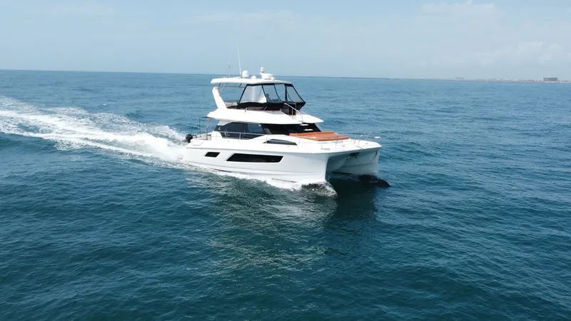 Slide: The Image of Aquila 44 CAT Cruising Bow View The 2021 Aquila 44 CAT, 'Hey Beautiful,' showcases a sleek and modern design as it glides effortlessly across the open water. The spacious bow features ample lounging space, perfect for relaxation while enjoying the sea breeze. The yacht's dual-hull desig - 7414003
