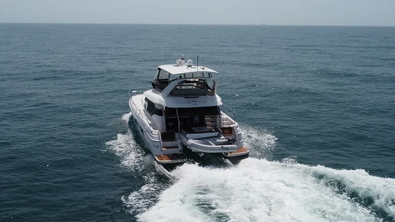 Slide: The Image of Aft View with Swim Platform This image showcases the aft view of the 2021 Aquila 44 CAT, emphasizing its spacious swim platform. The design allows for easy access to the water, perfect for leisure activities. The open deck layout provides a blend of luxury and functionality, ideal f - 7414026