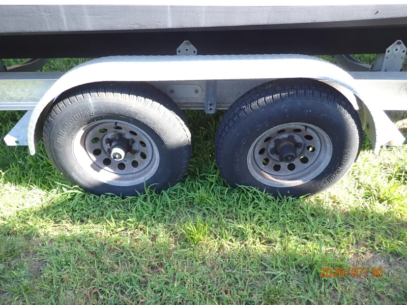 Slide: The Image of 22' Grady-White trailer starboard wheels - 7350326