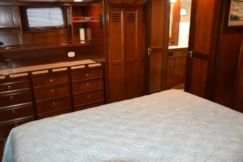 Slide: The Image of Portlights To Either Side Of The Stateroom And Note Abundance Of Drawers In Dresser Next To Cedar Lined Hanging Closet And Head Entry Door - 7509722