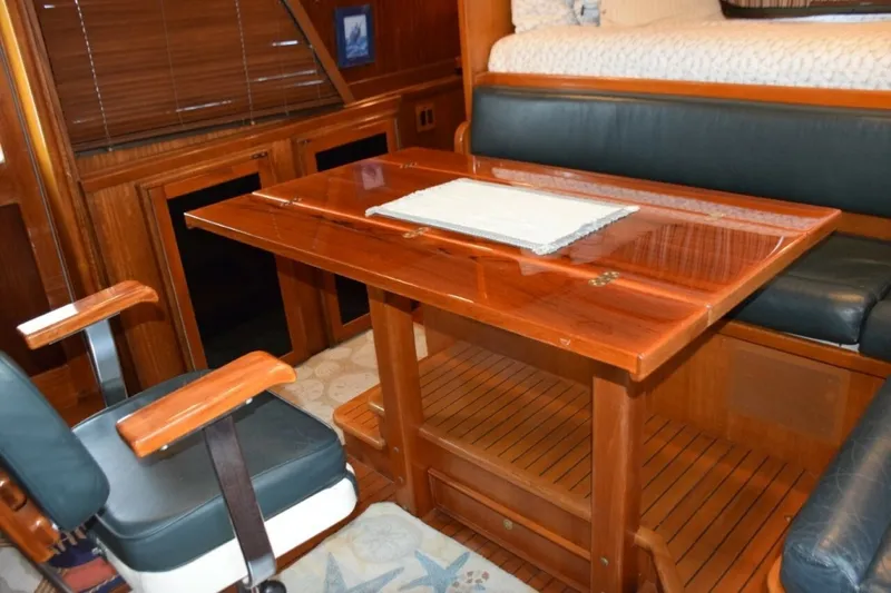 Slide: The Image of Pilothouse Table Expanded And Helm Chair Turned - 7509716