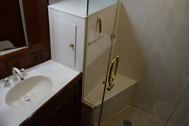 Slide: The Image of Master Vanity Top With Mirrored Medicine Cabinet And Glass Shower Enclosure With Seat - 7509726