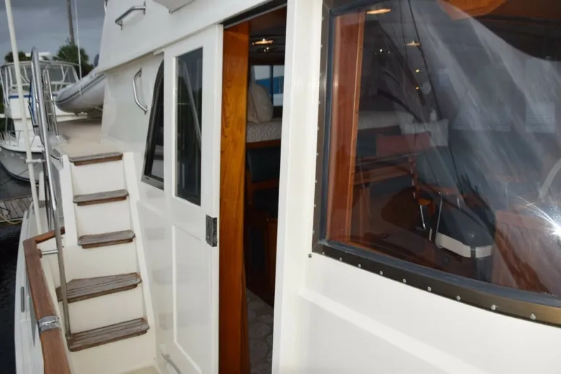 Slide: The Image of Pilothouse Door And Steps Up To Flybridge. Teak Bow Rail Cap. - 7509677