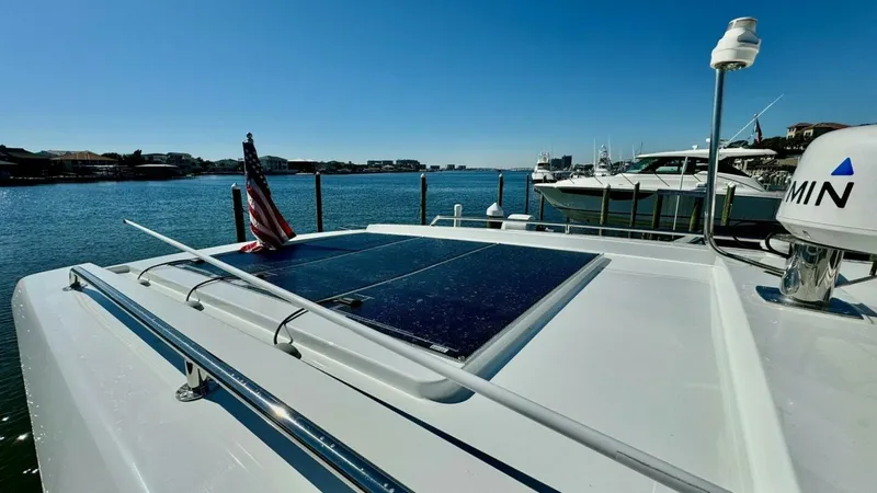 Slide: The Image of Flybridge with Solar Panels This image showcases the flybridge of the 2022 Beneteau Antares 11, featuring sleek solar panels for sustainable energy use. The spacious layout provides ample space for relaxation while enjoying panoramic views of the surrounding water. The clean lines a - 7403691