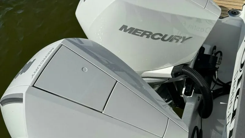 Slide: The Image of Dual Mercury Engines This image showcases the dual Mercury outboard engines on the Beneteau Antares 11, offering robust power and performance. The sleek design and efficient engineering of these engines ensure a smooth and reliable boating experience. Ideal for both leisurely - 7403694