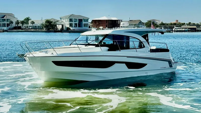 Slide: The Image of Starboard Side View in Marina This image showcases the sleek starboard side of the 2022 Beneteau Antares 11, highlighting its modern design and spacious layout. The expansive windows provide ample natural light and panoramic views, while the streamlined hull ensures efficient cruising - 7403699
