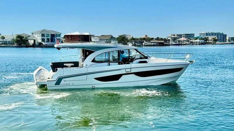 The Image of Starboard Profile on Open Water This image showcases the sleek starboard profile of the 2022 Beneteau Antares 11, gliding effortlessly on open water. The vessel features a modern design with large panoramic windows and a spacious cockpit, perfect for enjoying the sea breeze. The streaml - 7403676