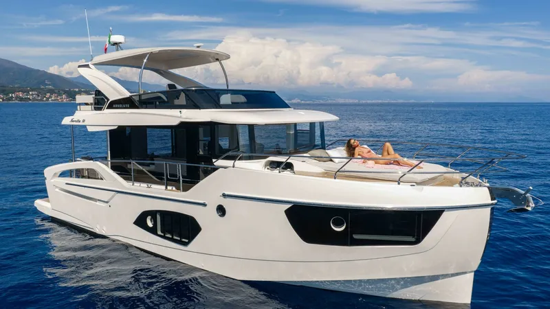Slide: The Image of Bow Area with Sunbathing Lounge The 2027 Absolute Navetta 50 showcases a spacious bow area featuring a luxurious sunbathing lounge, perfect for relaxation. The sleek design and panoramic windows enhance the vessel's modern aesthetic while offering stunning ocean views. This area provide - 7514488