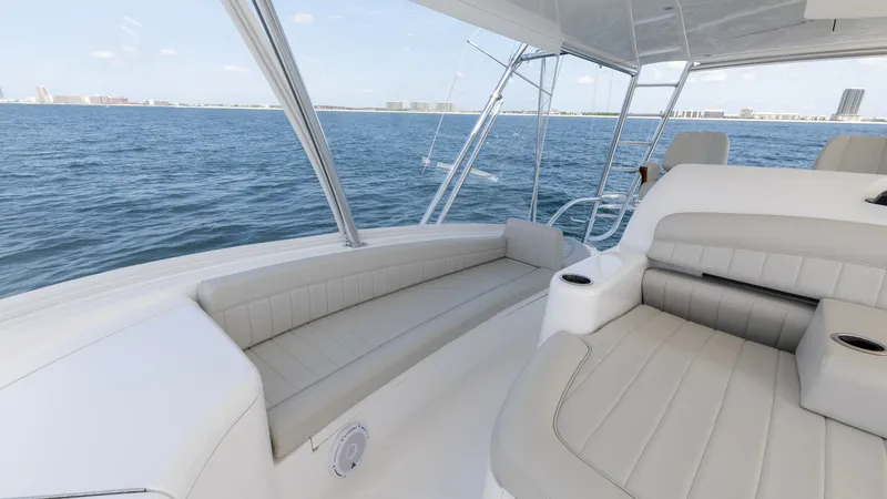 Slide: The Image of Flybridge Seating with Ocean View The flybridge of the 2025 Viking 74 Convertible features luxurious seating with plush, weather-resistant cushions. The spacious layout offers ample room for relaxation while enjoying panoramic ocean views. Stainless steel supports and a sleek design enhan - 7531202