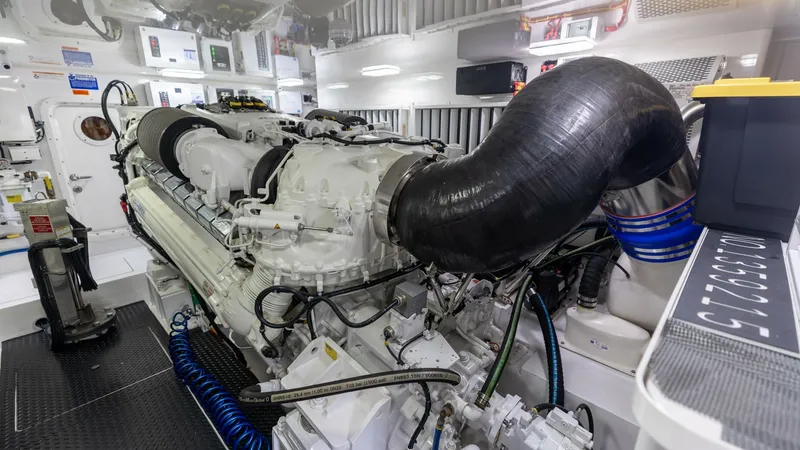 Slide: The Image of Engine Room with Advanced Machinery The engine room of the 2025 Viking 74 Convertible 'It Just Takes Time' showcases state-of-the-art engineering and meticulous craftsmanship. Featuring powerful, well-organized engines, the space is designed for optimal performance and accessibility. High-q - 7531186