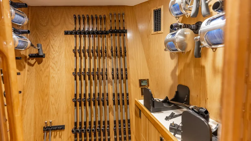 Slide: The Image of Custom Tackle Storage Room This spacious tackle storage room aboard the 2025 Viking 74 Convertible is meticulously designed for serious anglers. The room features custom racks for organizing an extensive collection of rods and reels, ensuring easy access and optimal protection. Hig - 7531178