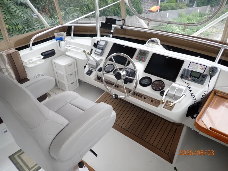 Slide: The Image of 43' Mainship flybridge helm2 - 7407519