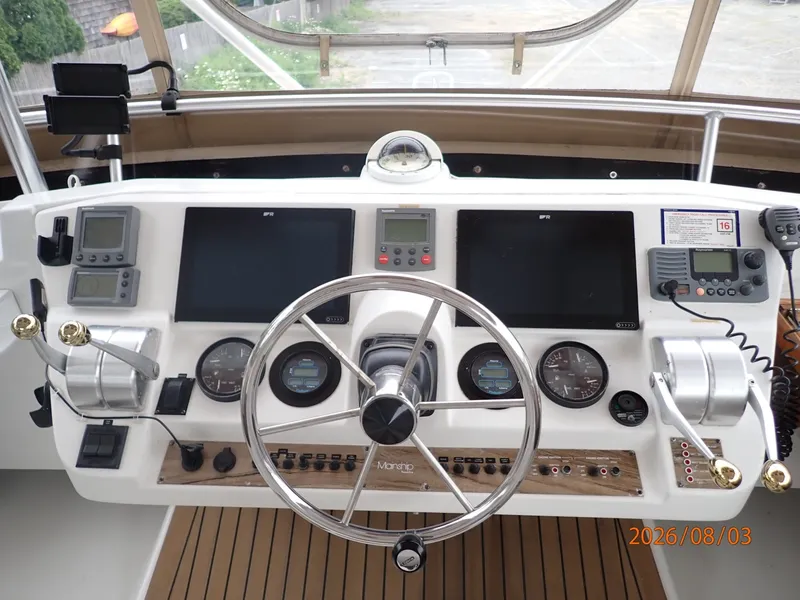 Slide: The Image of 43' Mainship flybridge helm3 - 7407520