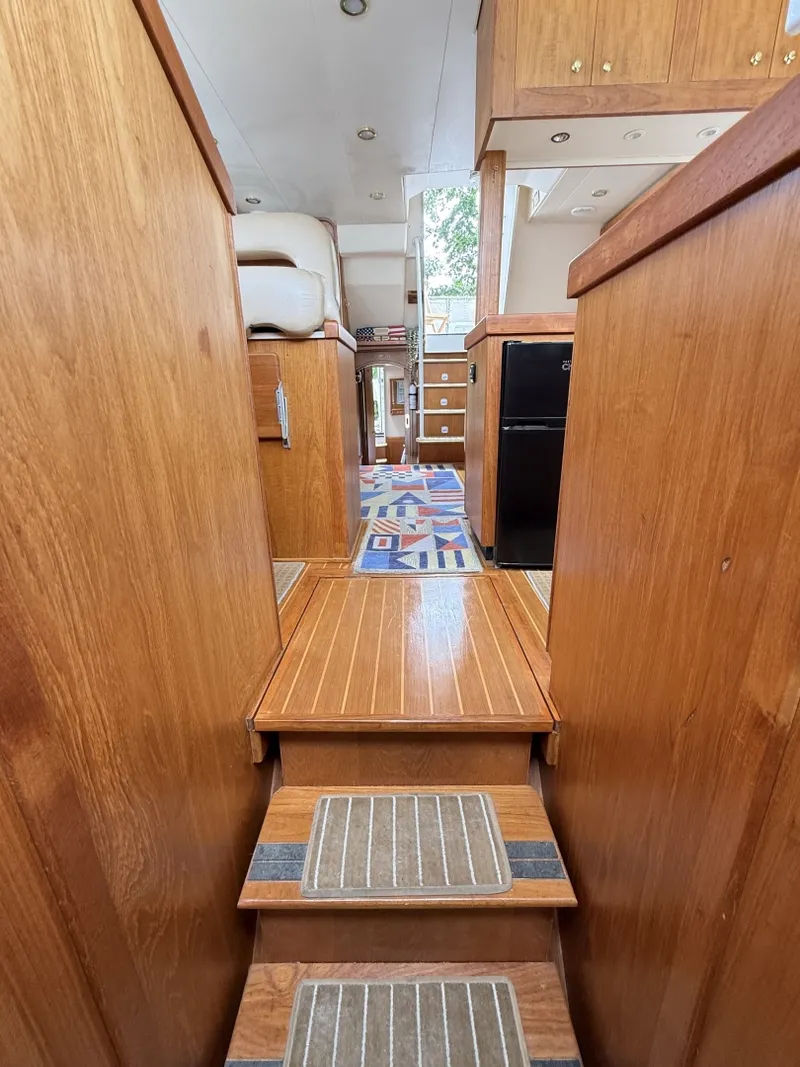 Slide: The Image of 43' Mainship guest stateroom companionway aft - 7407547