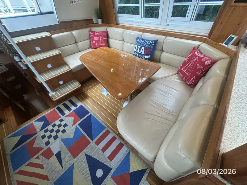 Slide: The Image of 43' Mainship salon port seating - 7407577