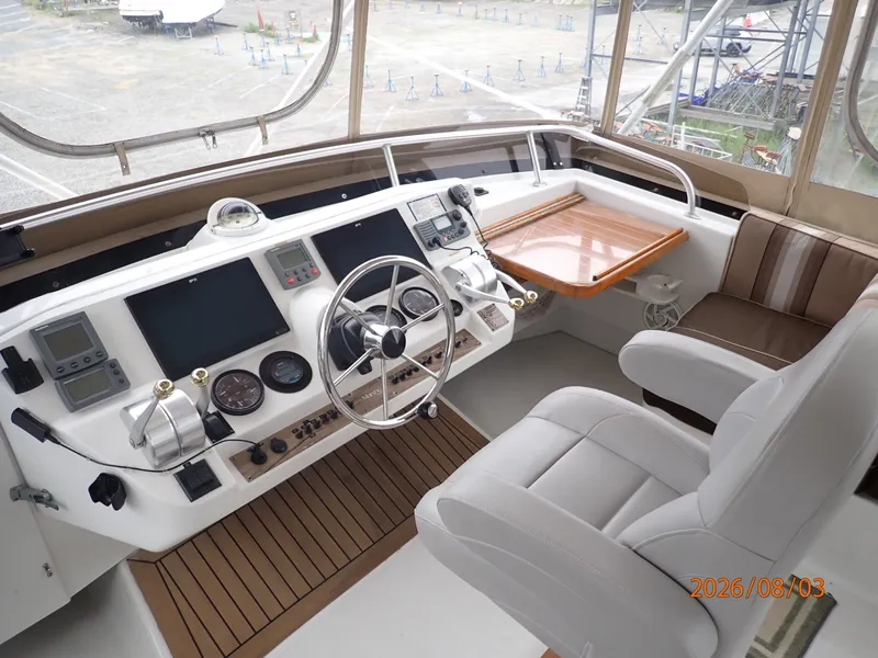 Slide: The Image of 43' Mainship flybridge helm1 - 7407518
