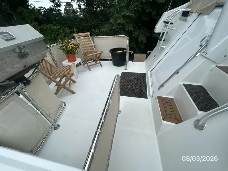 Slide: The Image of 43' Mainship trunk cabin port - 7407602