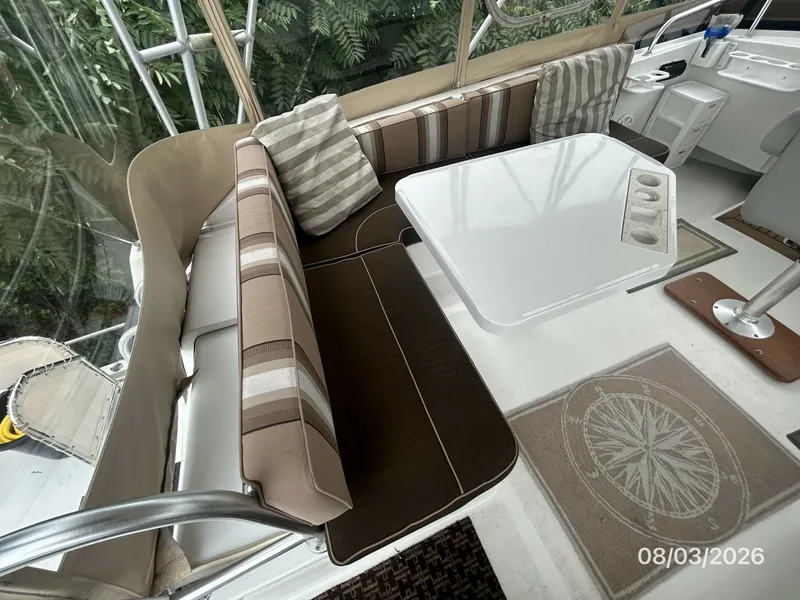 Slide: The Image of 43' Mainship flybridge port aft seating2 - 7407523