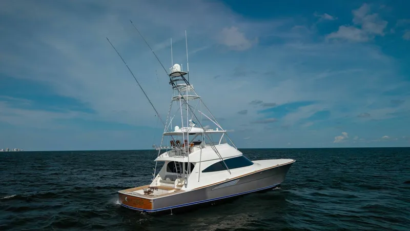 Slide: The Image of Aerial View of Viking 72 Convertible This image showcases the sleek profile of the 2018 Viking 72 Convertible, highlighting its robust sportfishing tower and spacious cockpit. The vessel's elegant lines and expansive deck are perfectly suited for both leisure and fishing activities. The rich - 7460626