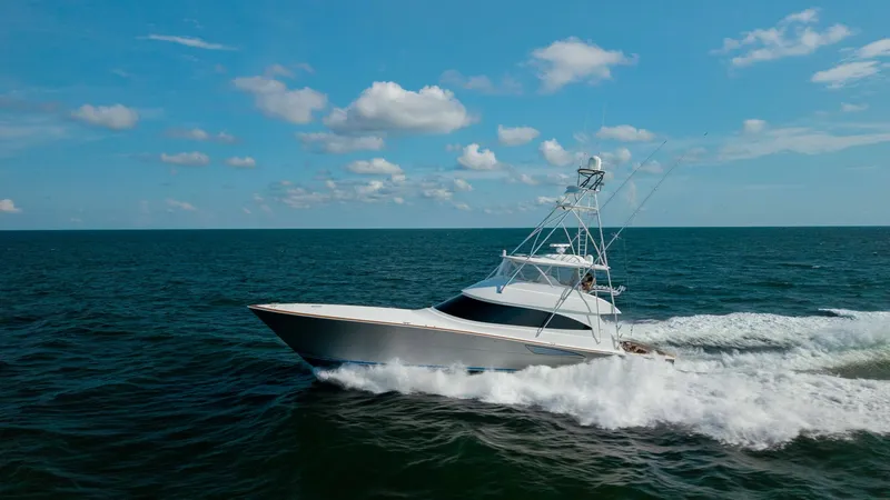 Slide: The Image of Viking 72 Convertible in Motion The 2018 Viking 72 Convertible 'Metal Masher' cruises powerfully through open waters, showcasing its sleek and aerodynamic hull design. The vessel's sportfishing tower and clean lines reflect its combination of luxury and performance. With its robust cons - 7460628