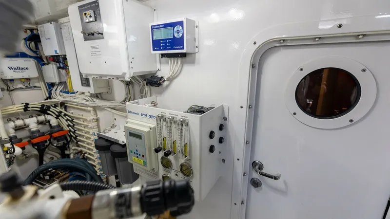 Slide: The Image of Engine Room Controls The engine room of the 2018 Viking 72 Convertible showcases a well-organized control panel and advanced monitoring systems. High-quality materials and precise engineering ensure reliable performance and ease of maintenance. The space is equipped with esse - 7460598