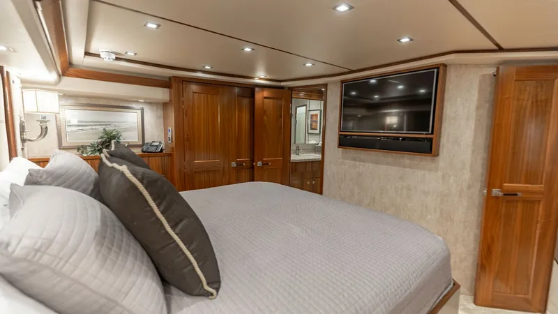 Slide: The Image of Luxurious Master Stateroom The master stateroom of the 2018 Viking 72 Convertible offers a spacious and elegant retreat. Featuring a plush, king-sized bed with high-quality bedding, this room is designed for ultimate comfort. Rich wood finishes, ambient recessed lighting, and a wal - 7460585