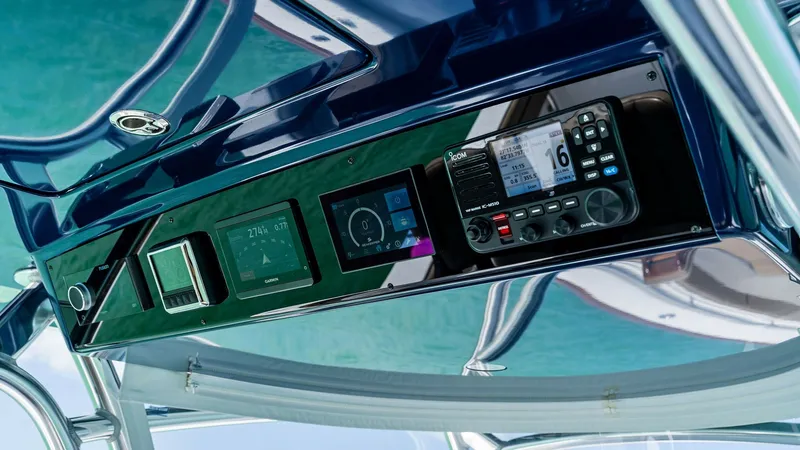 Slide: The Image of Helm Electronics Console Detail This image showcases the state-of-the-art electronics console on the Valhalla V-37, featuring advanced navigation and communication systems. The sleek design integrates multiple digital displays and control panels, ensuring optimal functionality and ease - 7471207