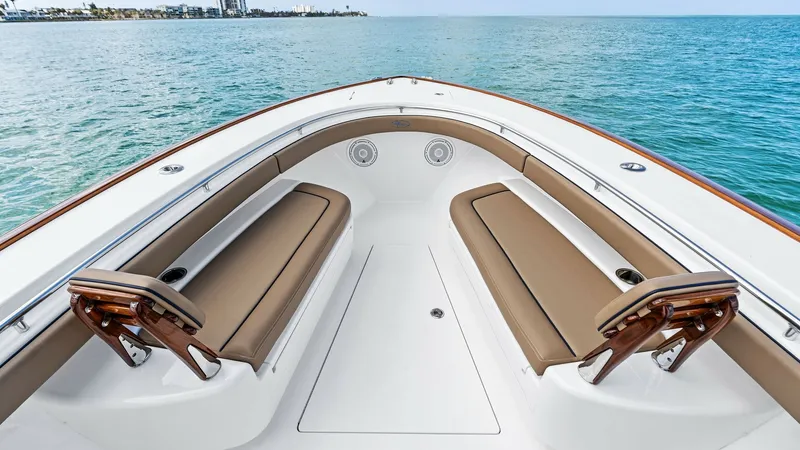 Slide: The Image of Spacious Bow Seating Area The bow of the 2024 Valhalla V-37 features inviting, cushioned seating for ultimate comfort while enjoying ocean views. The sleek design includes elegant wood accents and strategically placed cup holders for convenience. The open layout provides a perfect - 7471197