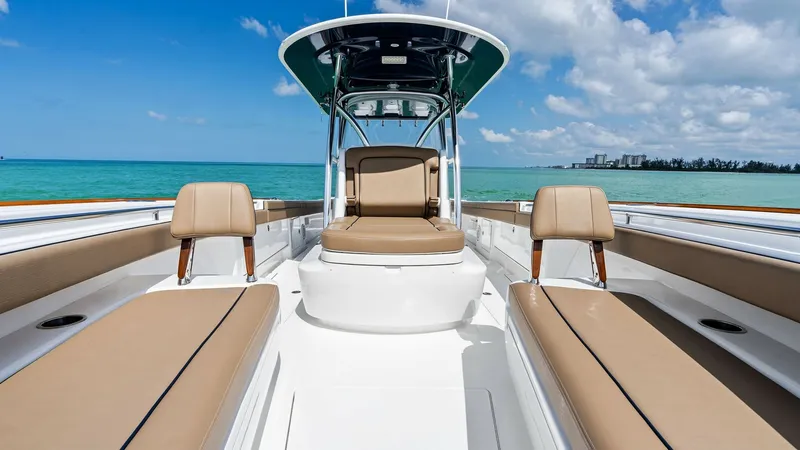 Slide: The Image of Spacious Forward Seating Area The Valhalla V-37's forward seating area offers ample comfort with its plush tan cushions and elegant, streamlined design. Perfect for relaxation, this space provides unobstructed views of the open water, enhancing the boating experience. The overhead T-t - 7471198