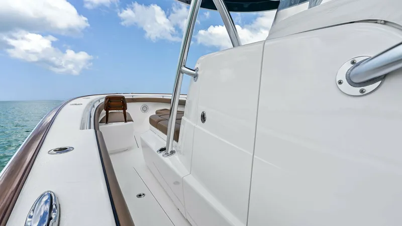Slide: The Image of Starboard Walkway and Bow Seating This image showcases the sleek starboard walkway of the 2024 Valhalla V-37, emphasizing its spacious design and easy accessibility. The layout features clean lines and high-quality finishes, with a view toward the comfortable bow seating area. Perfect for - 7471201