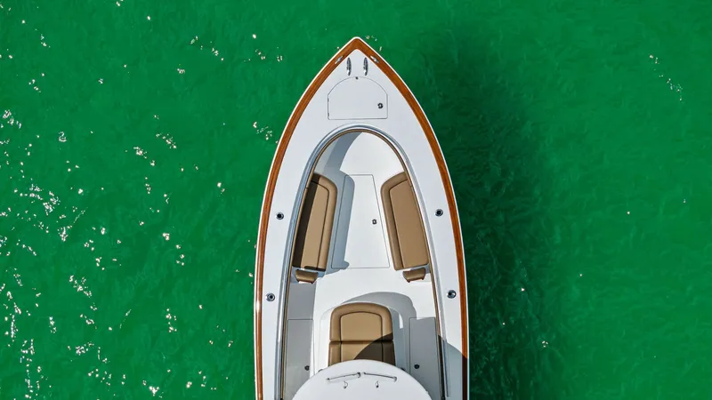 Slide: The Image of Bow Seating Area and Deck This aerial view showcases the sleek bow of the 2024 Valhalla Boatworks V-37, featuring comfortable seating with elegant tan cushions. The spacious layout offers ample room for relaxation and socializing, perfectly complemented by the pristine white deck. - 7471219