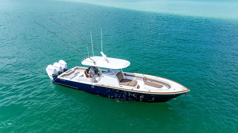 The Image of Aerial View of Valhalla V37 This image showcases the sleek design of the Valhalla Boatworks V-37, 'BIRD', set against a stunning turquoise sea. The spacious deck features plush seating, ideal for relaxation and entertaining, while the helm is equipped with state-of-the-art controls - 7471163