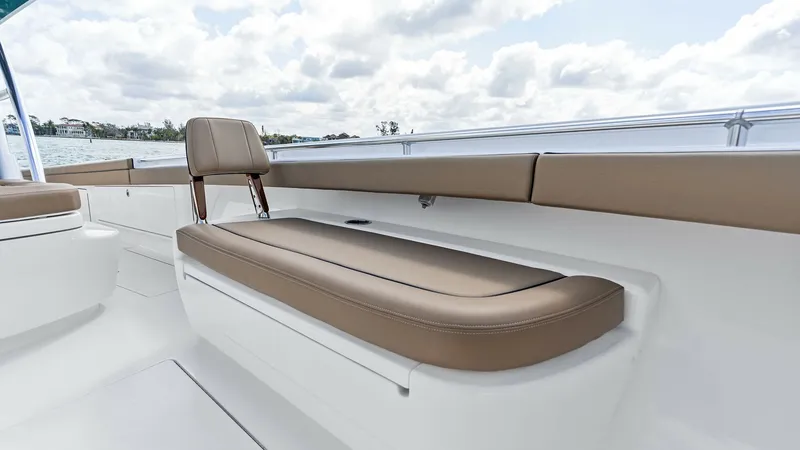 Slide: The Image of Spacious Aft Deck Seating The 2024 Valhalla V-37 features a luxurious aft deck with plush, tan upholstered seating. This area is perfect for relaxation, offering ample space and comfort for guests to enjoy the views. The sleek design and quality materials enhance the vessel's eleg - 7471189