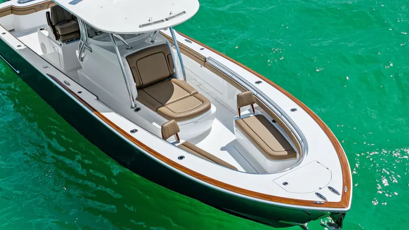 Slide: The Image of Bow Seating Area with Sun Pads The 2024 Valhalla V-37 showcases a spacious bow with plush seating and sun pads, perfect for relaxation. The elegant teak accents along the gunwale enhance its sophisticated design. Ample storage options are seamlessly integrated, ensuring a clutter-free - 7471222
