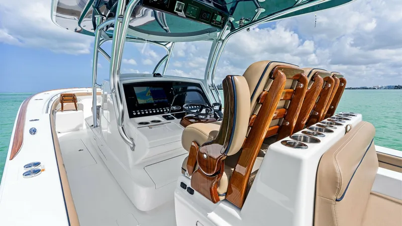 Slide: The Image of Helm Station with Luxurious Seating The helm station of the 2024 Valhalla V-37 'BIRD' features a sleek, modern dashboard equipped with advanced navigation technology. Luxurious, ergonomically designed seating offers comfort and style, with high-quality leather finishes and polished wood acc - 7471203