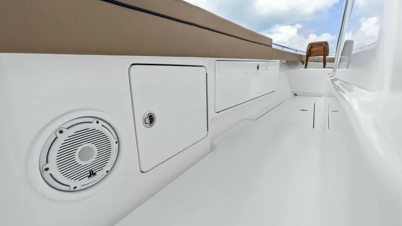 Slide: The Image of Starboard Cockpit Storage and Seating The starboard cockpit of the 2024 Valhalla V-37 features sleek, integrated storage compartments and a comfortable bench seat. The clean lines and high-gloss finish enhance the modern aesthetic, while the built-in speaker ensures quality sound for entertai - 7471202