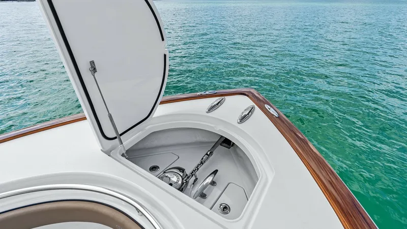 Slide: The Image of Anchor Locker with Chain Storage The V-37's well-designed anchor locker offers convenient access to the anchor chain and windlass system, ensuring smooth operation. The sleek, clean lines of the hatch and polished stainless-steel fittings reflect the high-quality craftsmanship of Valhall - 7471192