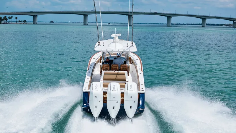 Slide: The Image of Aft View with Triple Outboard Engines The 2024 Valhalla V-37 showcases its power with three robust outboard engines, cutting through the water effortlessly. The spacious aft deck features comfortable seating, perfect for enjoying the thrill of the open sea. This dynamic view highlights the ve - 7471245