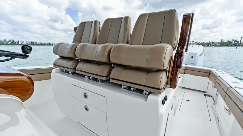 Slide: The Image of Helm Seating Area with Storage The helm seating area of the 2024 Valhalla V-37 features luxurious, ergonomically designed captain's chairs, providing both style and comfort. Upholstered in premium materials, these seats offer excellent support for long voyages. Beneath the seats, integ - 7471215