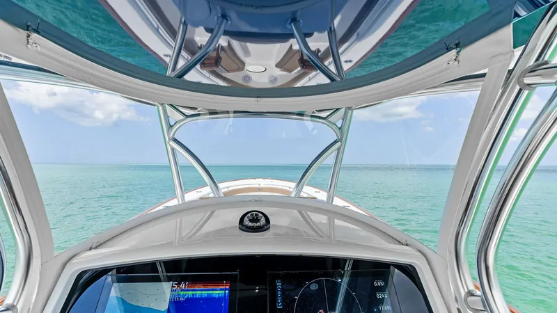 Slide: The Image of Helm Station with Ocean View The helm station of the 2024 Valhalla Boatworks V-37 offers a panoramic view of the open sea, combining function with breathtaking aesthetics. The state-of-the-art navigation displays are seamlessly integrated, providing the captain with all necessary con - 7471209