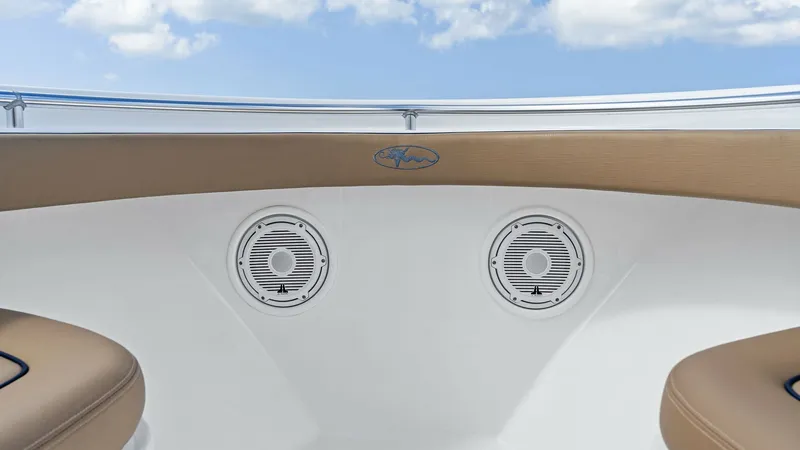Slide: The Image of Bow Seating with Speakers The bow area of the 2024 Valhalla V-37 features comfortable seating with plush tan cushions, perfect for relaxation. Integrated speakers provide excellent sound quality, enhancing the onboard entertainment experience. The sleek design and high-quality mat - 7471193
