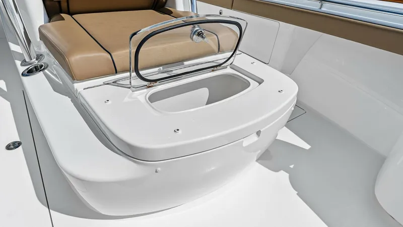 Slide: The Image of Cockpit Seating with Storage Hatch This image showcases the cockpit area of the Valhalla V-37, featuring elegant tan cushioned seating. The design integrates a practical storage hatch beneath the seat, offering functionality without compromising style. The clean, white finish and sleek lin - 7471200