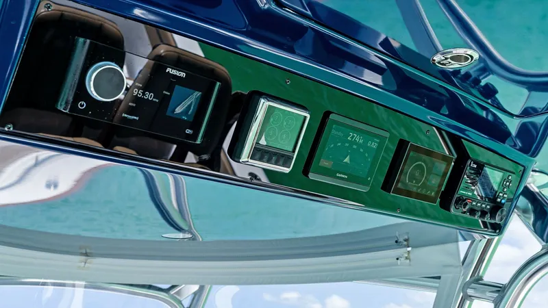 Slide: The Image of Advanced Helm Electronics Panel The 2024 Valhalla V-37 features a sleek helm electronics panel, showcasing state-of-the-art navigation and control systems. The panel includes multiple high-resolution displays for seamless access to vital information, enhancing the captain's command expe - 7471208