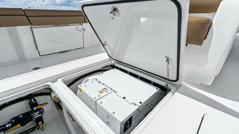 Slide: The Image of Deck Storage Compartment Access This image showcases a well-designed deck storage compartment on the 2024 Valhalla V-37. The compartment is neatly organized, providing easy access to essential equipment and components. Its secure latching system and sleek integration into the deck highl - 7471182